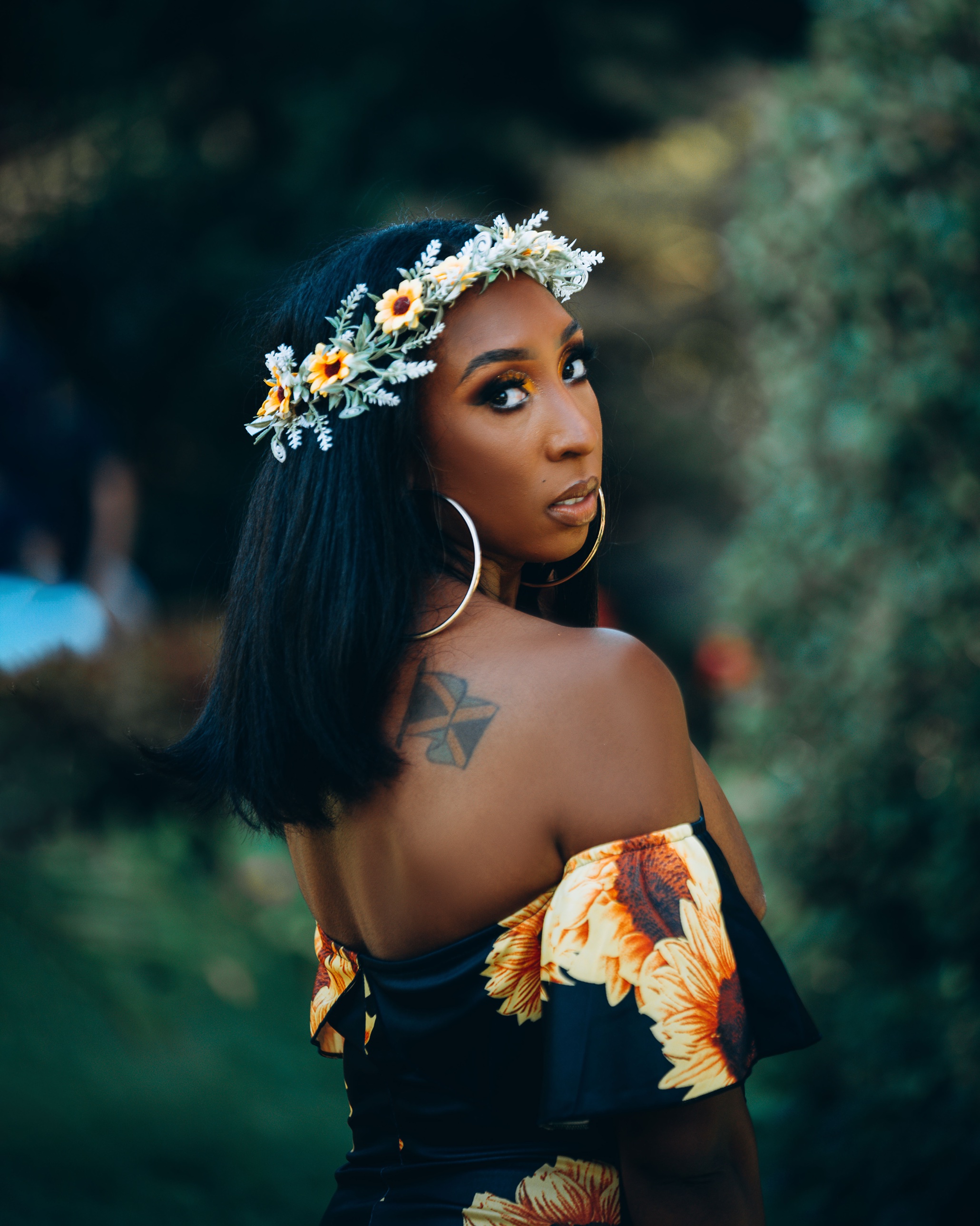 Ty Kelly, founder of Lucid Luxury, wearing a flower crown